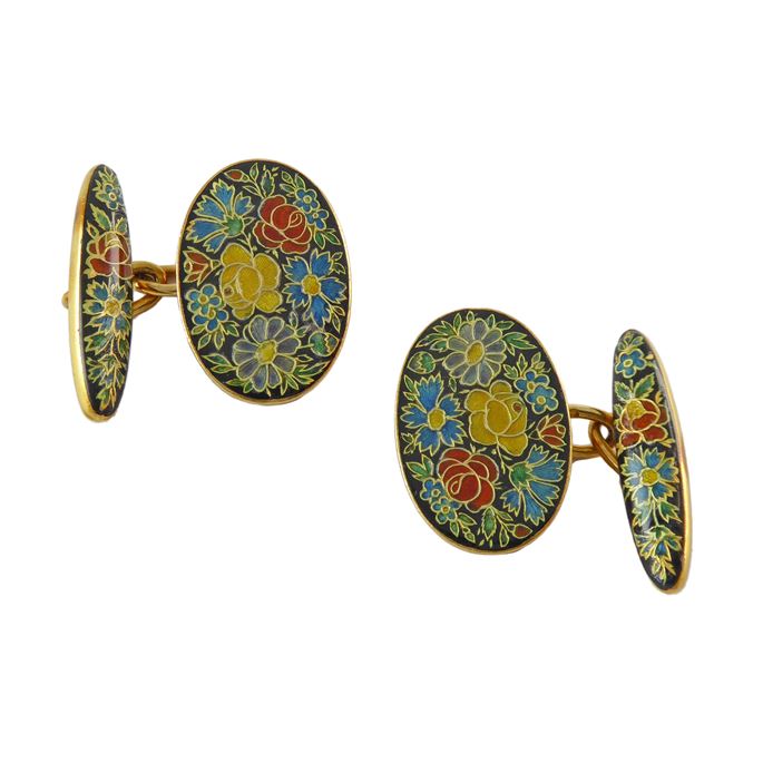 Pair of cloisonne floral enamel and gold cufflinks, French c.1920, decorated with flowerheads on a black ground, each with one oval plaque opposite a baton, chain connections | MasterArt